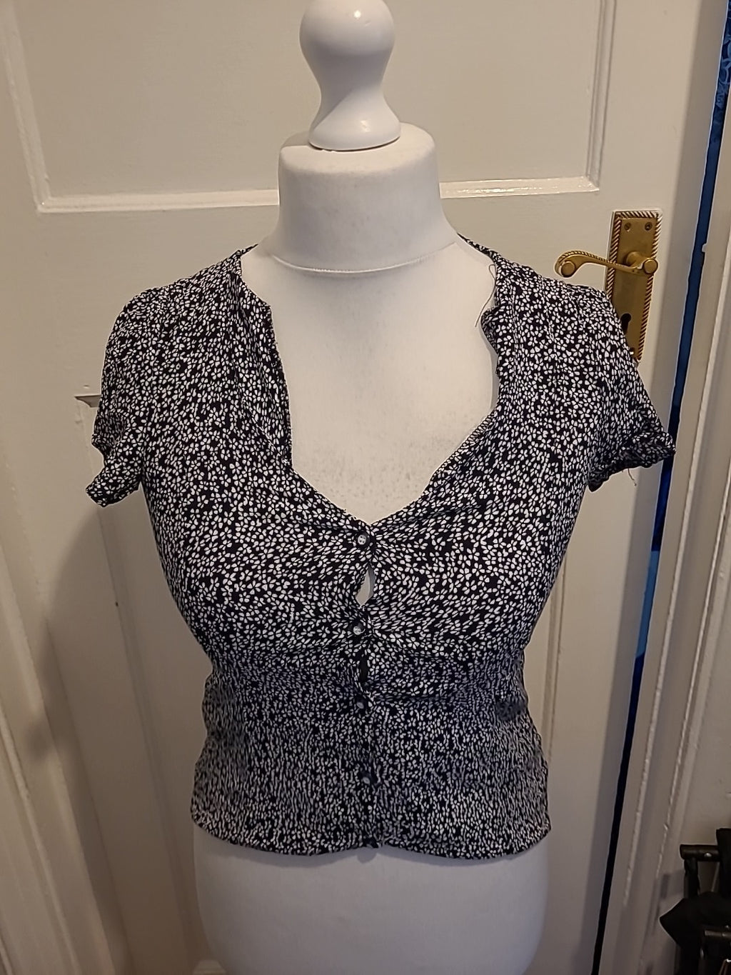 Ladies MNG Size XS Black And White Short Sleeved Floral Blouse