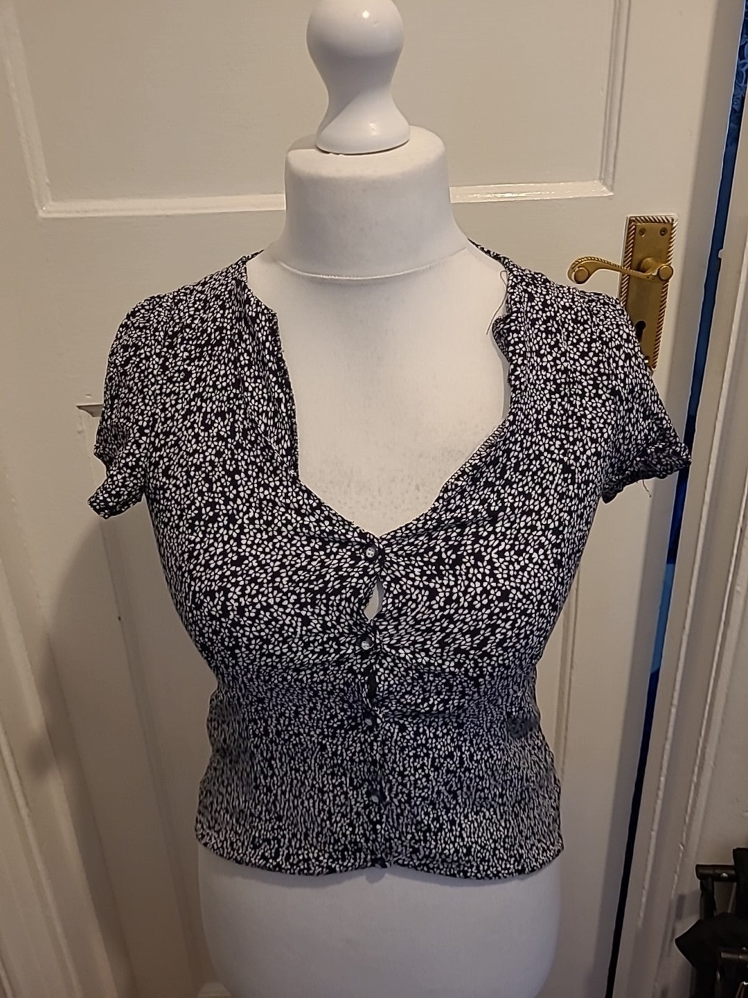 Ladies MNG Size XS Black And White Short Sleeved Floral Blouse