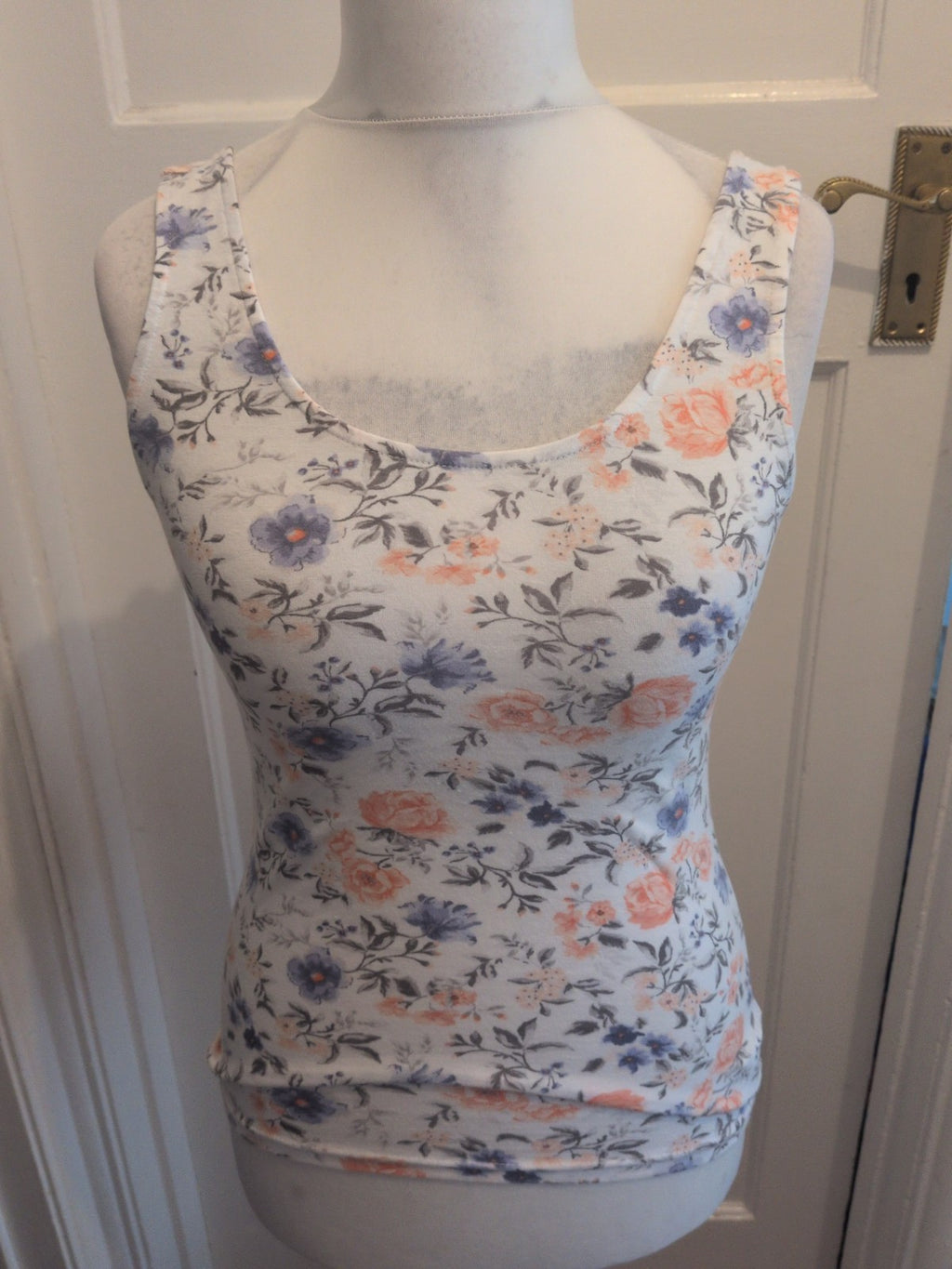 Divided Medium White Floral Sleeveless Blouse