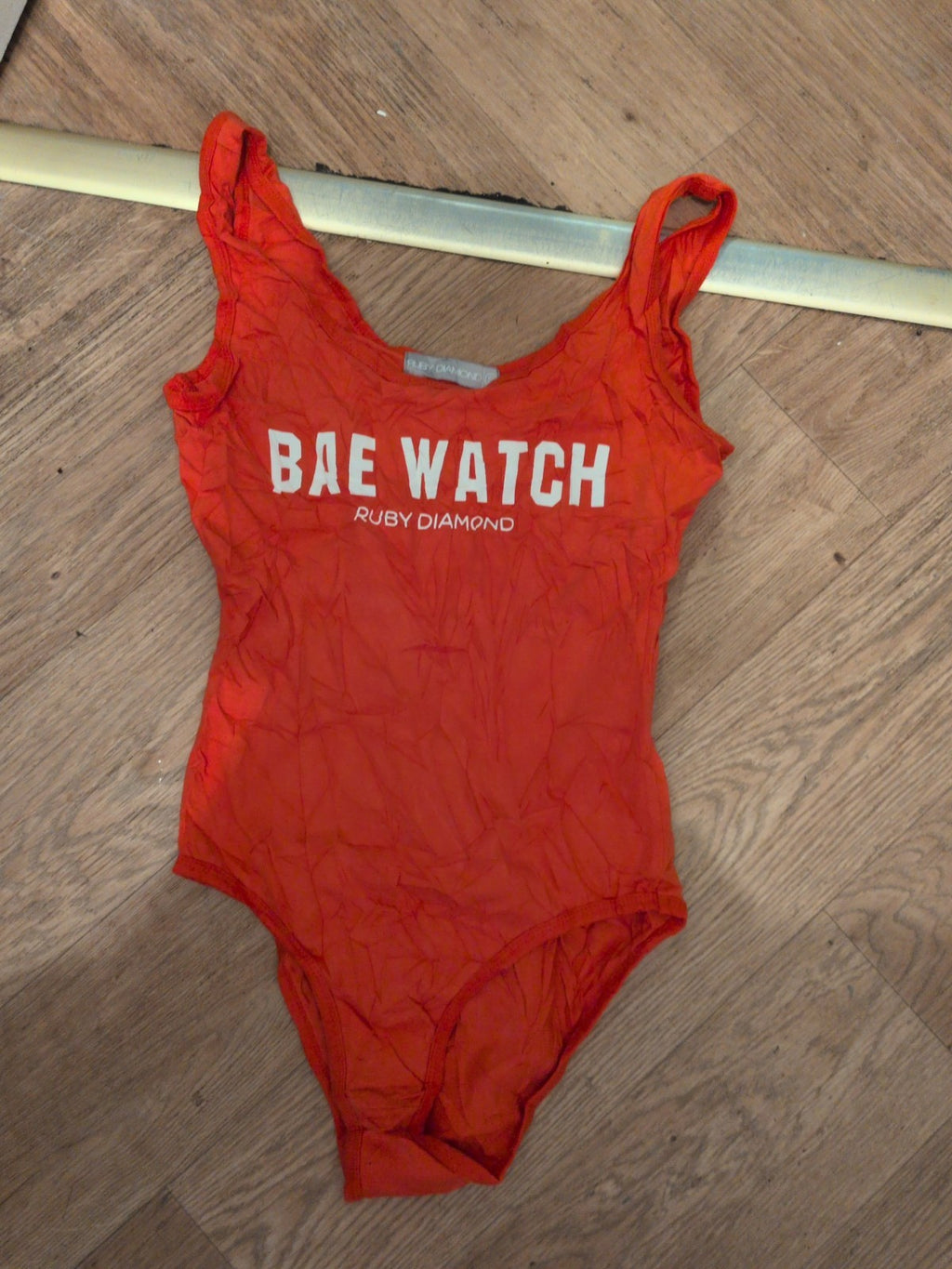 Ruby Diamond Small Orange Bae Watch Sleeveless Bodysuit