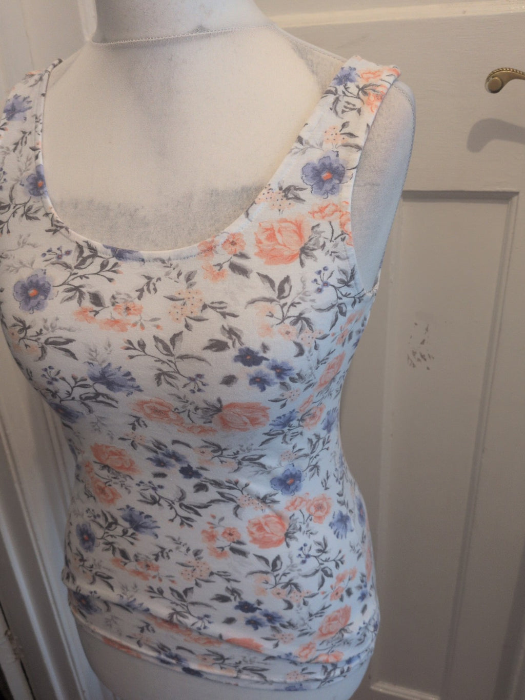 Divided Medium White Floral Sleeveless Blouse