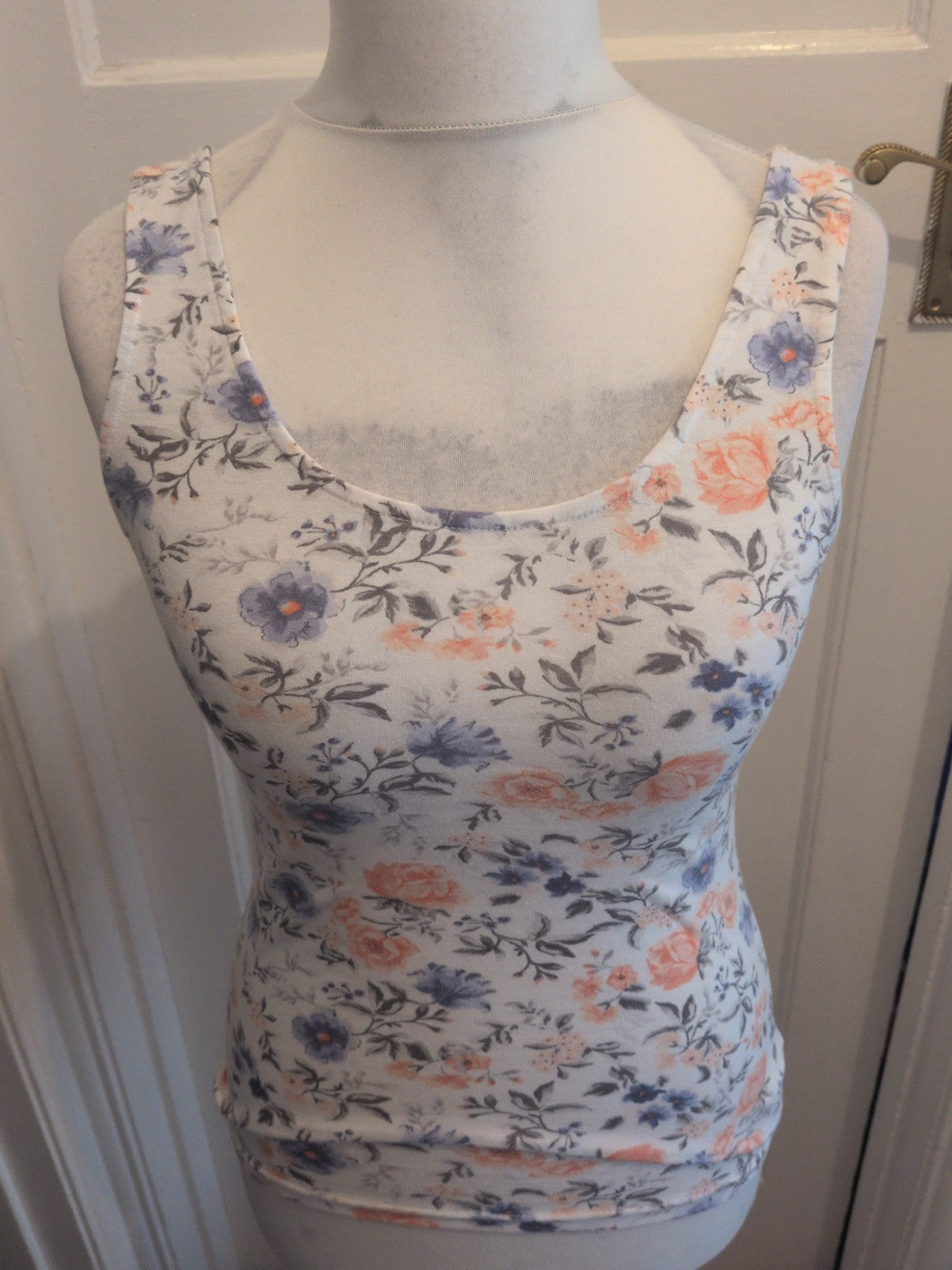 Divided Medium White Floral Sleeveless Blouse