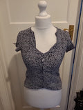 Ladies MNG Size XS Black And White Short Sleeved Floral Blouse