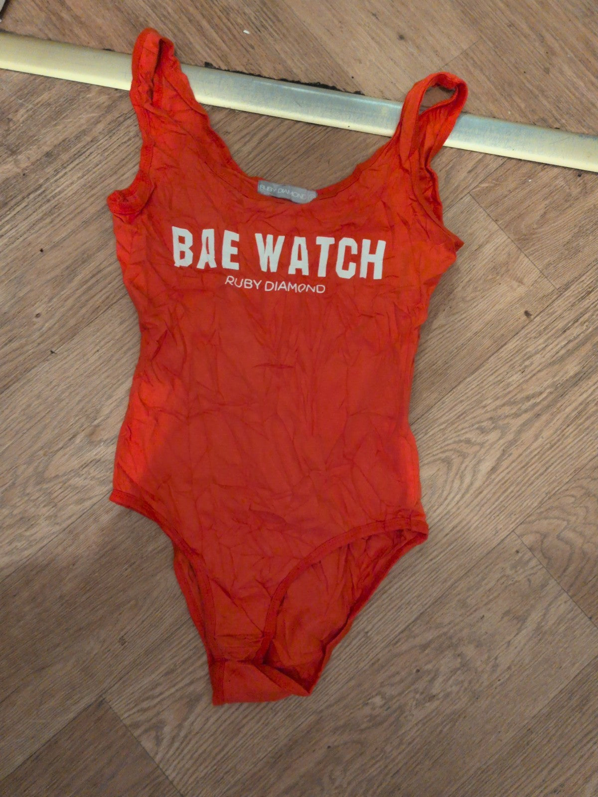 Ruby Diamond Small Orange Bae Watch Sleeveless Bodysuit